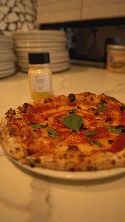 Classic margherita pizza cooked at Shop 225 in their wood fired oven