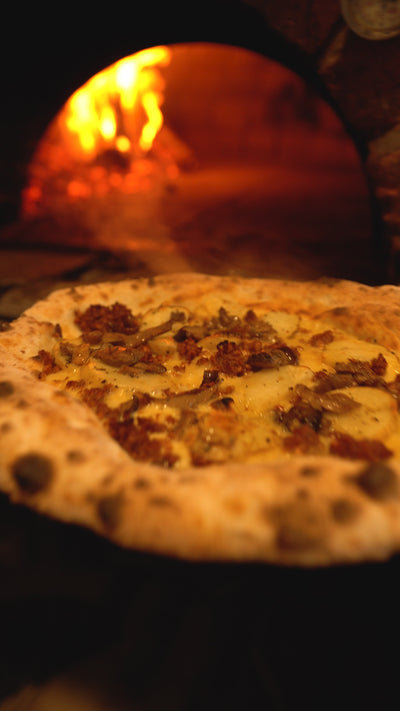 Potato pizza cooked at Shop 225 in their wood fired